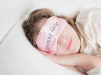 woman-in-beauty-rest-mask-in-pillow.png